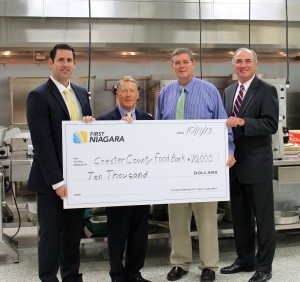     First Niagara's Allan Burkley (from left) poses with Robert MacNeil, board chairman of the Chester County Food Bank; Larry Welsch, its executive director; and Bob Kane, First Niagara's eastern Pennsylvania regional president.