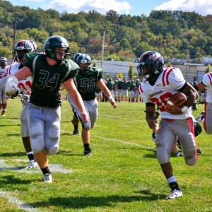     Shanahan's Matt Evans pursues Coatesville's Isaiah Flamer. With Daquan Worley out, Flamer stepped up to provide consistent running yards.