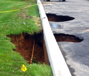The storm left these giant sink holes at Colonial Hyundai in Thorndale. Although the waters had largely receded amongst Thursday sunshine, reminders of the ferocity of Wednesday's storm could be seen across Chester County.