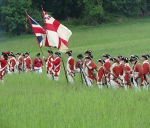 A group of British soldiers advances as the battle begins.