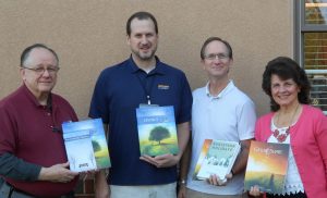 Calvary Fellowship facilitators of holiday grief seminars for those having lost a loved one due to death or are experiencing separation or divorce plan upcoming sessions, along with additional adult workshops to Help Grieving Children during the holidays. From left are Casey Jones, DivorceCare and Celebrate Victory facilitator, Care Pastor Bob VanArsdale, and David Pinkerton and Mary Derstine, GriefShare facilitators. Registration currently is underway for all the sessions.